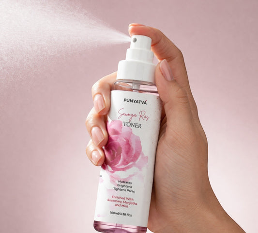 PUNYATVA Saumya Ras facial toner mist with rose illustration, 100ml bottle being sprayed.